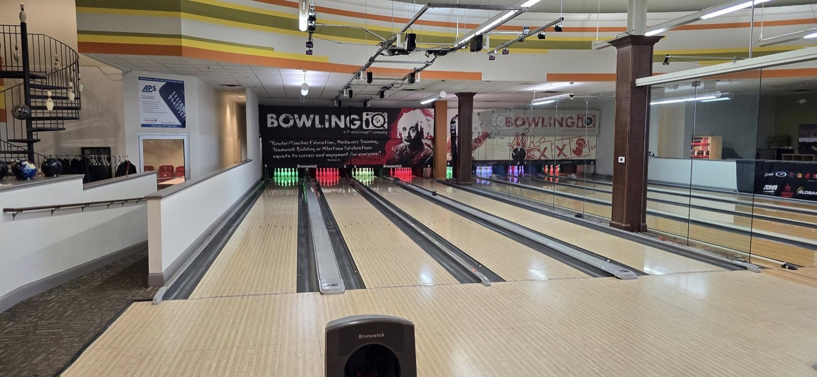 Bowling IQ practice lanes with the Bowler and Coaches Education mural