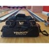 Velocity 3 Ball Triple Tote Black Gold at the lanes with the add-on shoe bag clipped on, sold separately