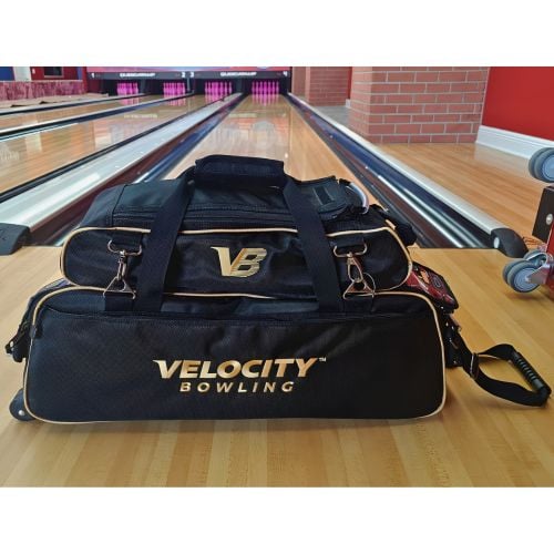 Velocity 3 Ball Triple Tote Black Gold at the lanes with the add-on shoe bag clipped on, sold separately